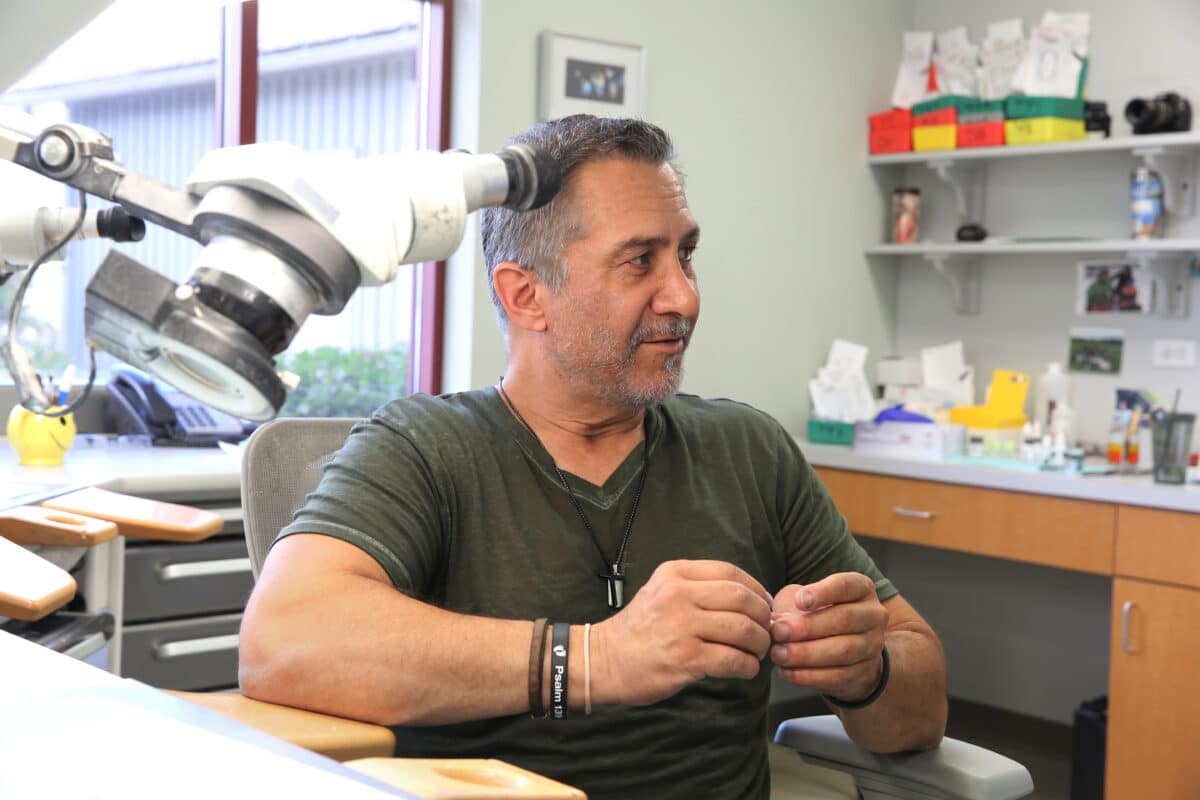 Portrait of John Sanchez, Lead Artist and Technician, whose expertise ensures precision and aesthetics for every dental implant restoration.